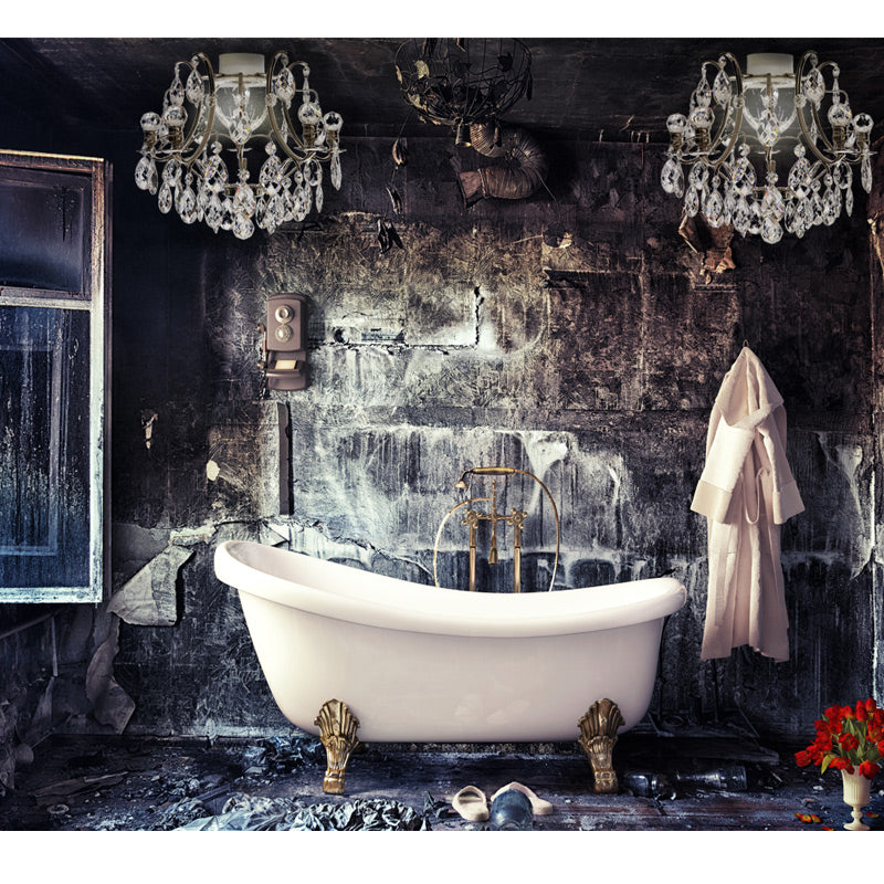 Nickel bathroom chandelier above a bath